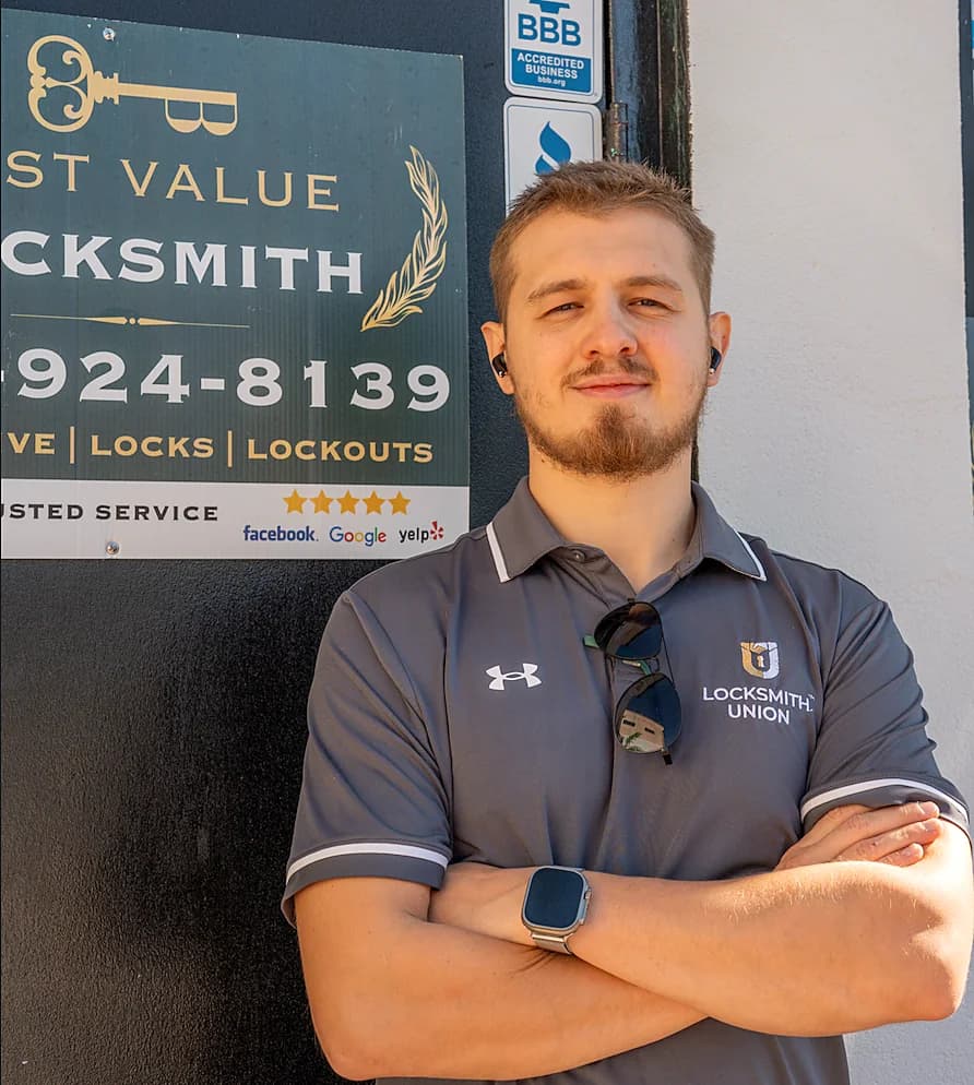 Best Value Locksmith technician in a Locksmith Union polo at the office door